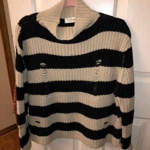 Mock neck sweater with distressing